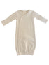 Cream-colored baby sleep gown with long sleeves and buttons, featuring subtle stripes throughout.