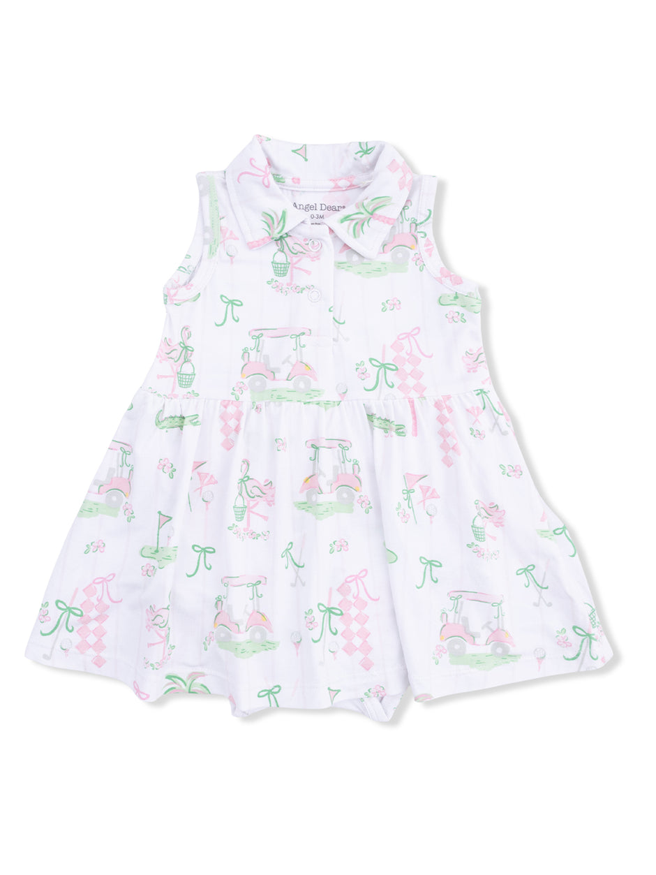 White dress with pastel golf-themed patterns, including carts, flowers, and ribbons. Suitable for casual wear.