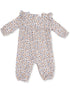 Floral baby romper with off-shoulder design, featuring blue flowers on a white background and elasticized cuffs.