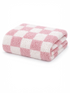Folded pink and white checkered towel displayed on a light background. Soft, fluffy texture visible.