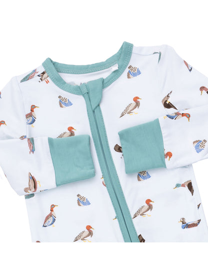 Toddler pajamas with a duck print, featuring a zip front and turquoise accents on sleeves and collar.