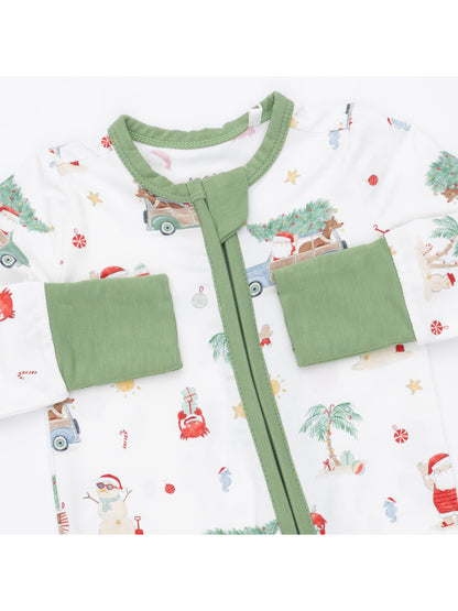 Baby onesie with festive prints, green trim, and zipper closure featuring Santa, trees, and holiday icons.