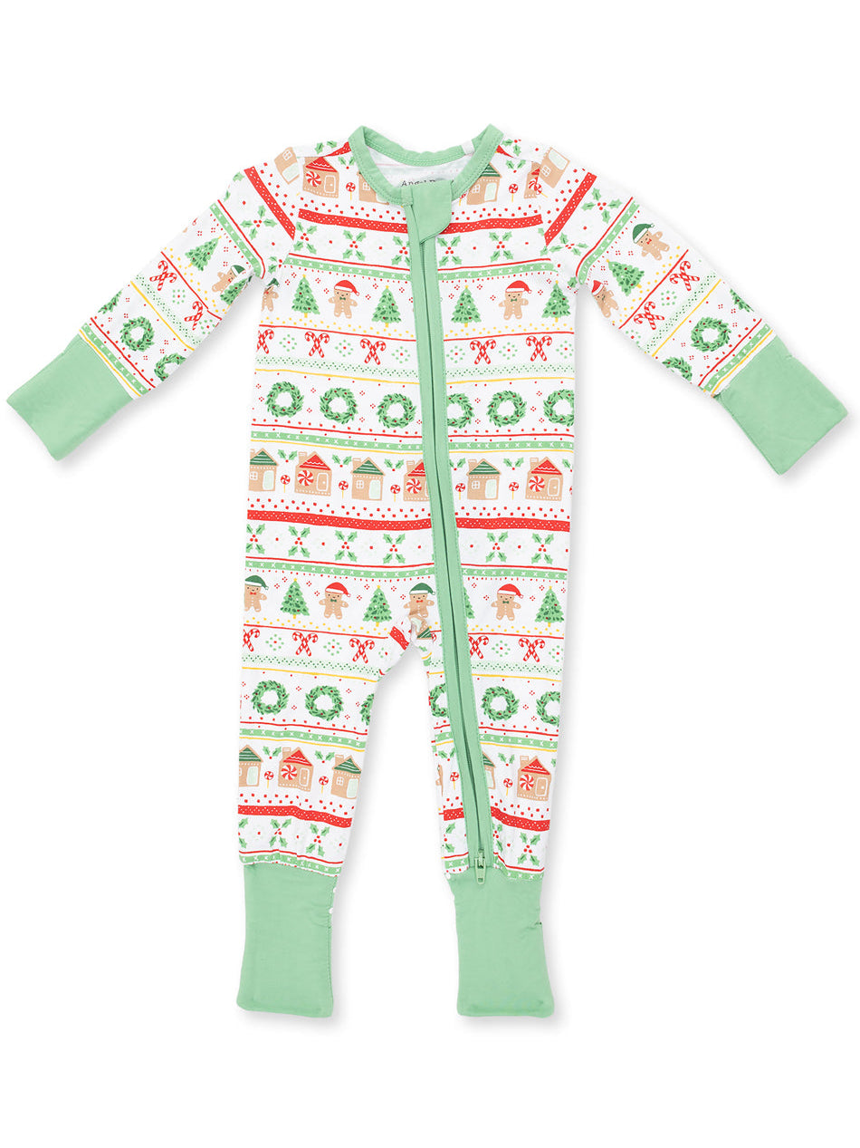 Christmas-themed toddler onesie with festive prints of trees, candy canes, and gingerbread figures.