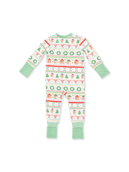 Baby holiday footed pajamas featuring festive patterns of gingerbread, trees, and wreaths in green and red.