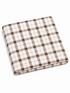 Plaid fabric in white and brown colors, folded neatly, showcasing a classic checkered pattern.