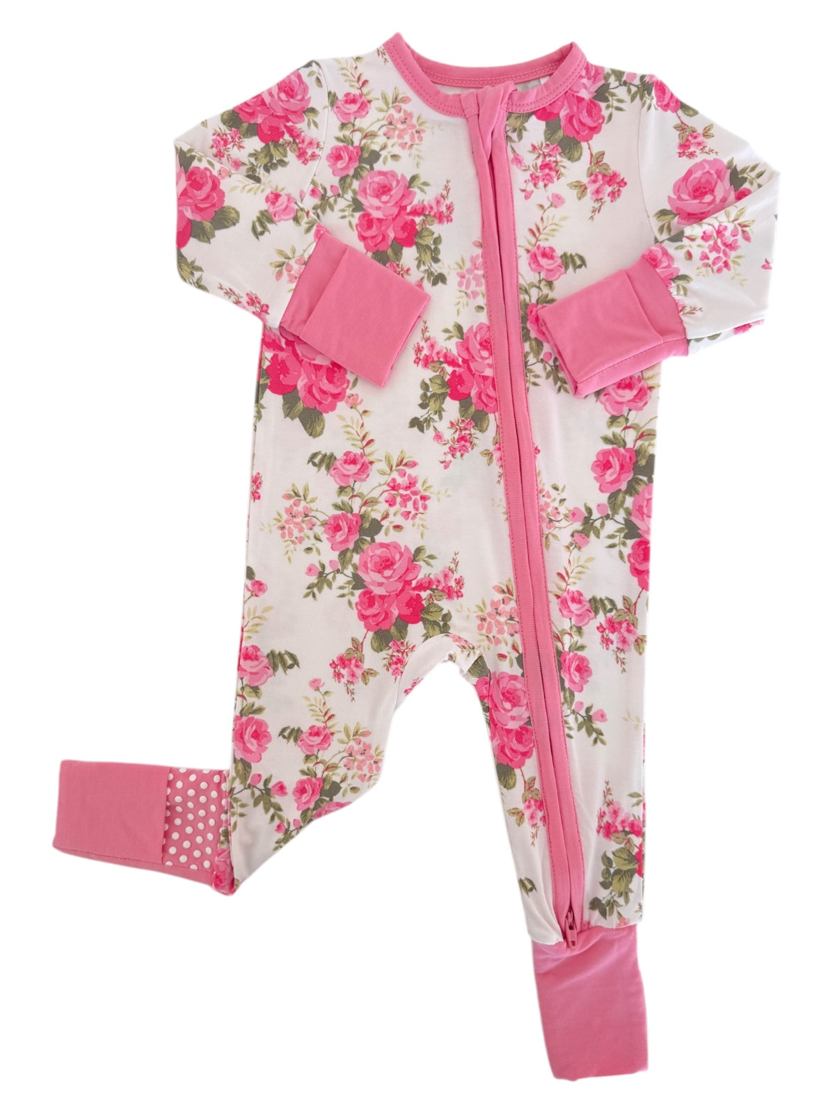 Floral baby onesie in pink and white with a front zipper and snap cuffs. Ideal for comfort and style.