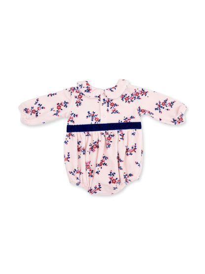 Floral-patterned baby romper in pink with a navy blue waistband and long sleeves. Ideal for infants' casual wear.