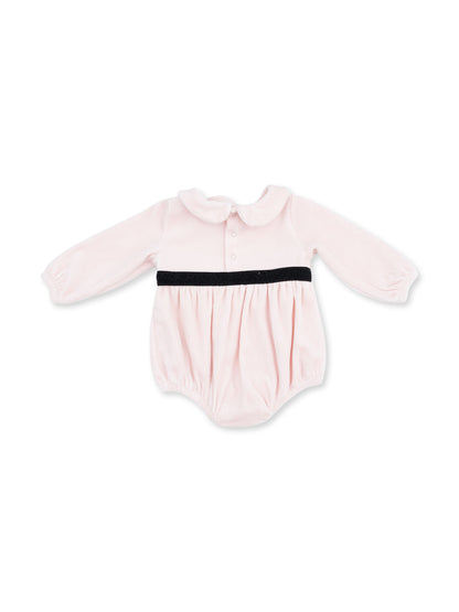 Pink baby onesie with long sleeves and a black belt; features a collared neckline and button front.