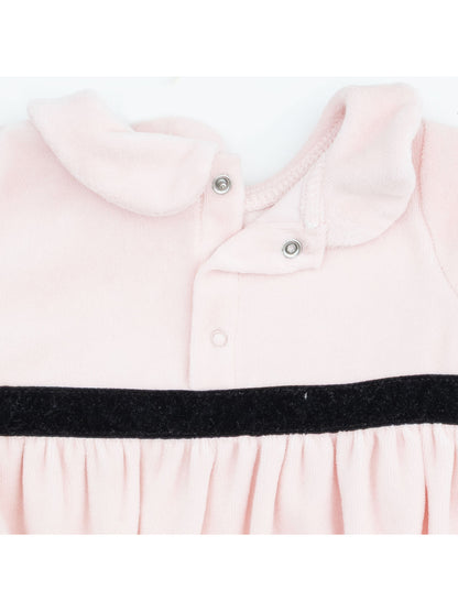 Light pink dress with a collar and black waistband detail, featuring snap closures at the neckline.