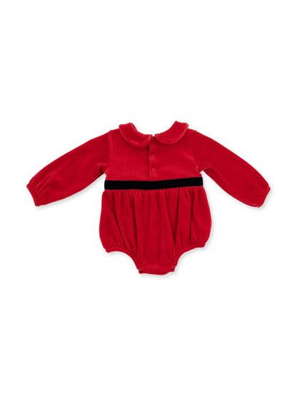 Red baby romper with long sleeves and a black waistband, featuring a rounded collar and button closure.