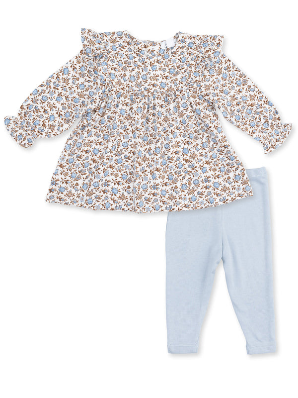 Floral top with ruffles paired with light blue leggings for a cute toddler outfit.