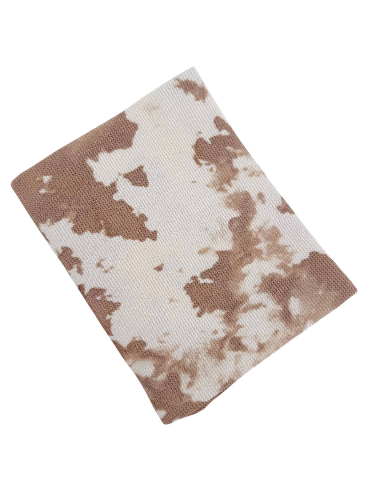 Brown and white tie-dye fabric swatch with a textured surface.