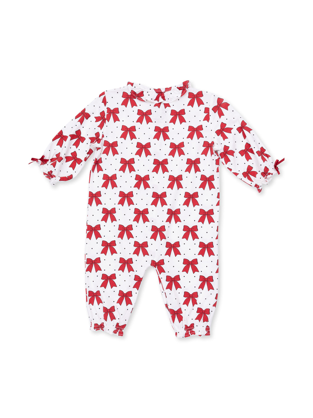 Red bow-patterned baby romper on a white background with polka dots, featuring puff sleeves and elastic cuffs.