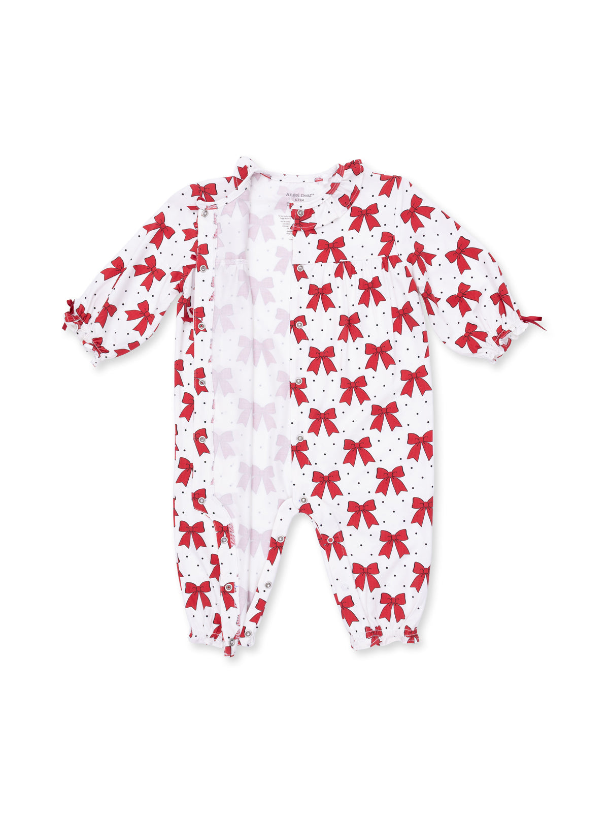 White baby romper with red bow print and polka dots, featuring long sleeves and gathered leg openings.