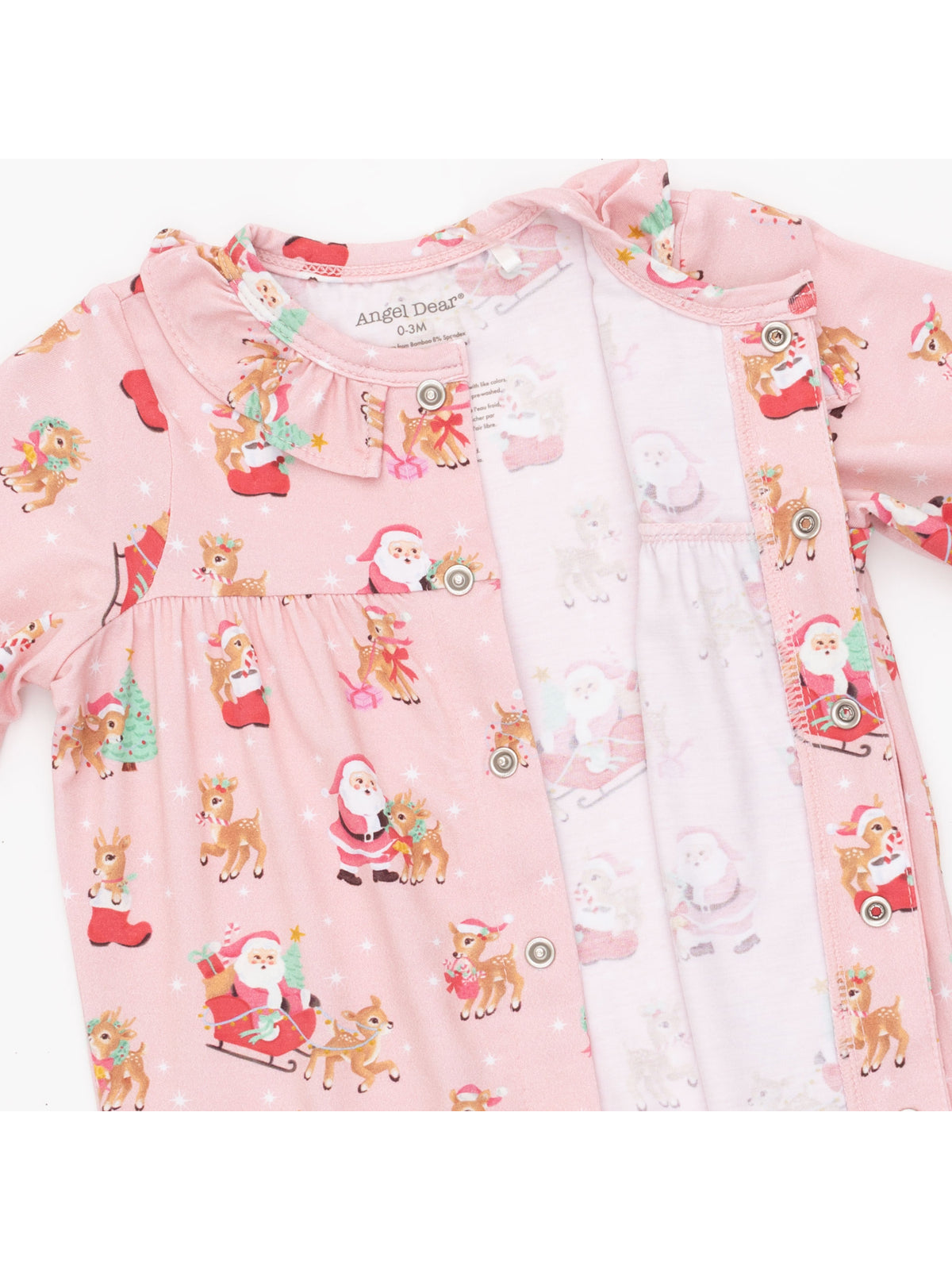 Pink baby pajamas featuring playful Christmas designs with Santa and reindeer. Perfect for winter celebrations.