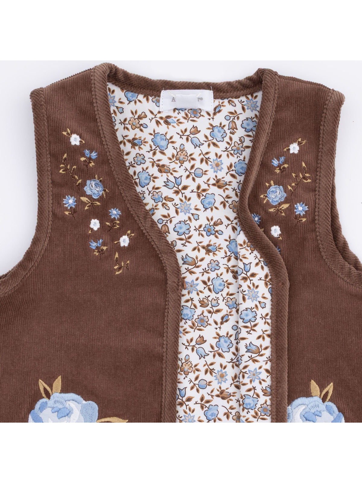 Brown embroidered vest with floral lining, showcasing delicate blue and white flowers on a light background.