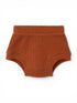 Rust-colored ribbed toddler underwear on a white background.