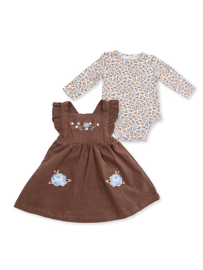 Brown floral dress with ruffled straps and a floral long-sleeve onesie, ideal for infants.