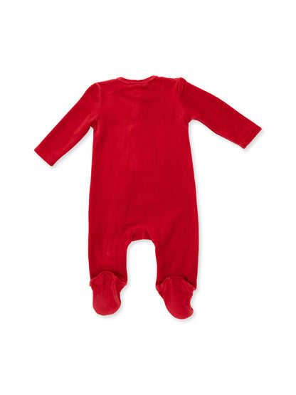 Red velvet baby onesie with long sleeves and footed design, viewed from the back.