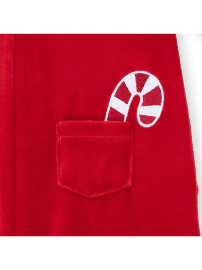 Red fabric with a pocket featuring a white and red striped candy cane design.