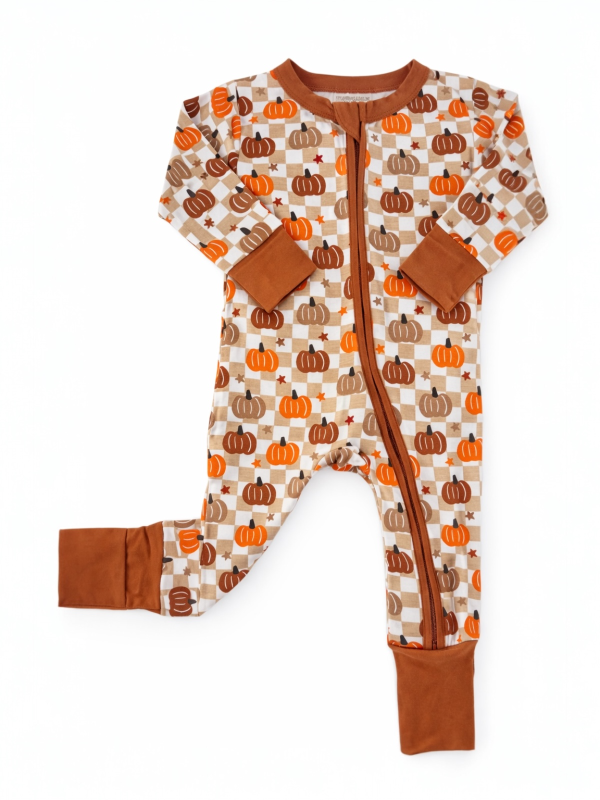 Brown and orange toddler pajama set with pumpkin print on a checkered background.