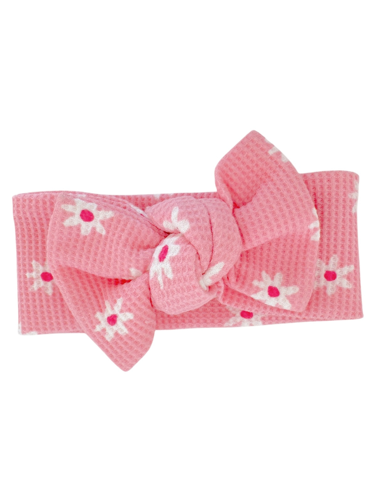 Pink headband with a large bow, featuring white flowers with pink centers.