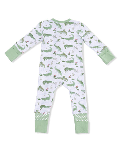 Green and white children's pajama suit with alligator and nature print on the back.