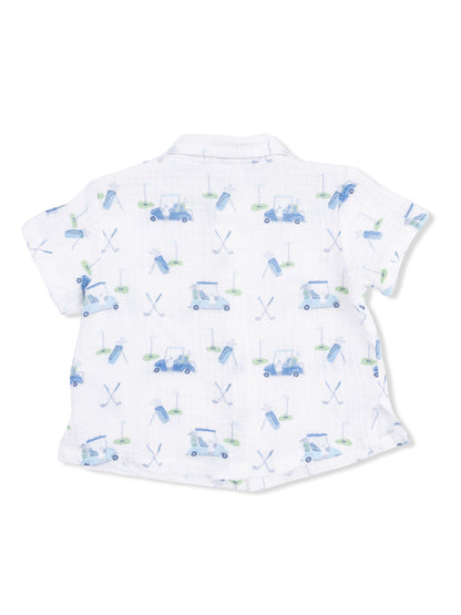 White short-sleeve shirt with a playful golf-themed print, featuring carts, clubs, and golf balls.