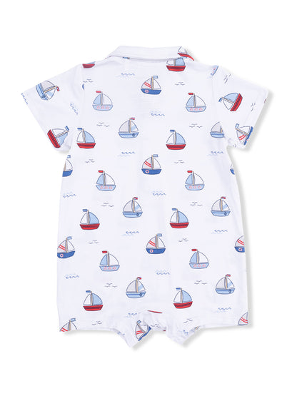 White onesie with a pattern of colorful sailboats and waves, designed for infants.