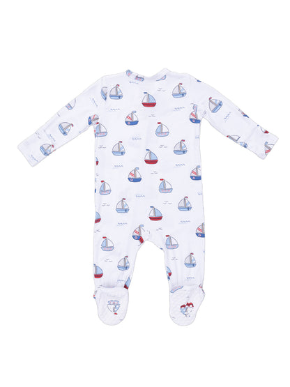 White baby onesie with sailboat pattern and long sleeves, featuring footed design for comfort.