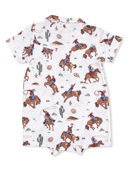 Children's short-sleeve onesie with cowboy and horse print, featuring cacti and desert scenery.