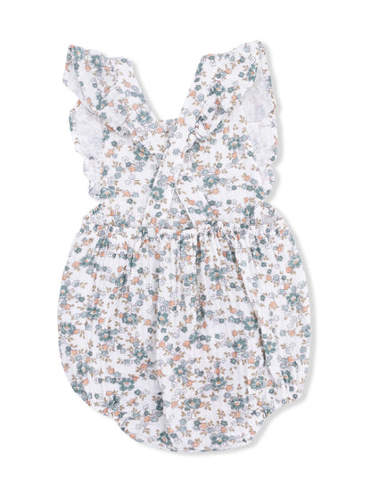 Floral baby romper with ruffled straps, featuring a white background with green and orange flowers.
