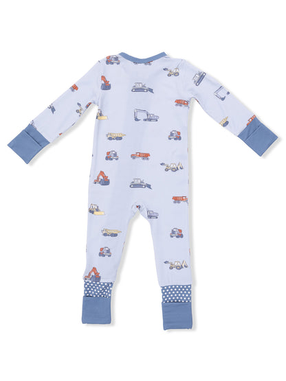 Back view of a children's blue pajama with colorful construction vehicle patterns and blue cuffs.