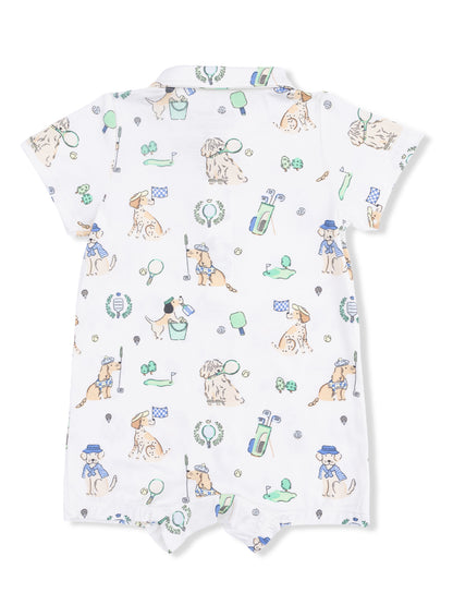 White baby romper with playful dog illustrations and golf-themed elements.