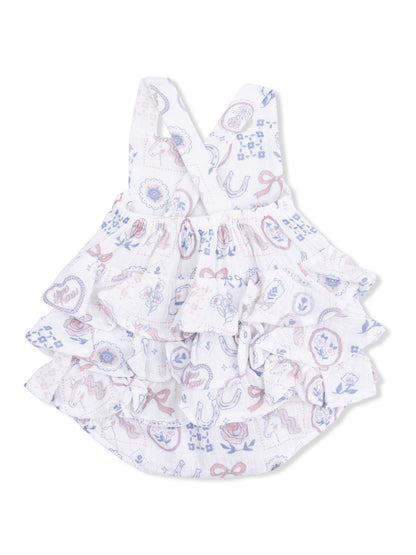 White dress with ruffles and pastel illustrations of flowers, bows, and horses. Ideal for casual wear.