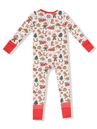 Toddler pajamas in festive print with gingerbread men, animals, and holiday motifs. Red accents on sleeves and cuffs.