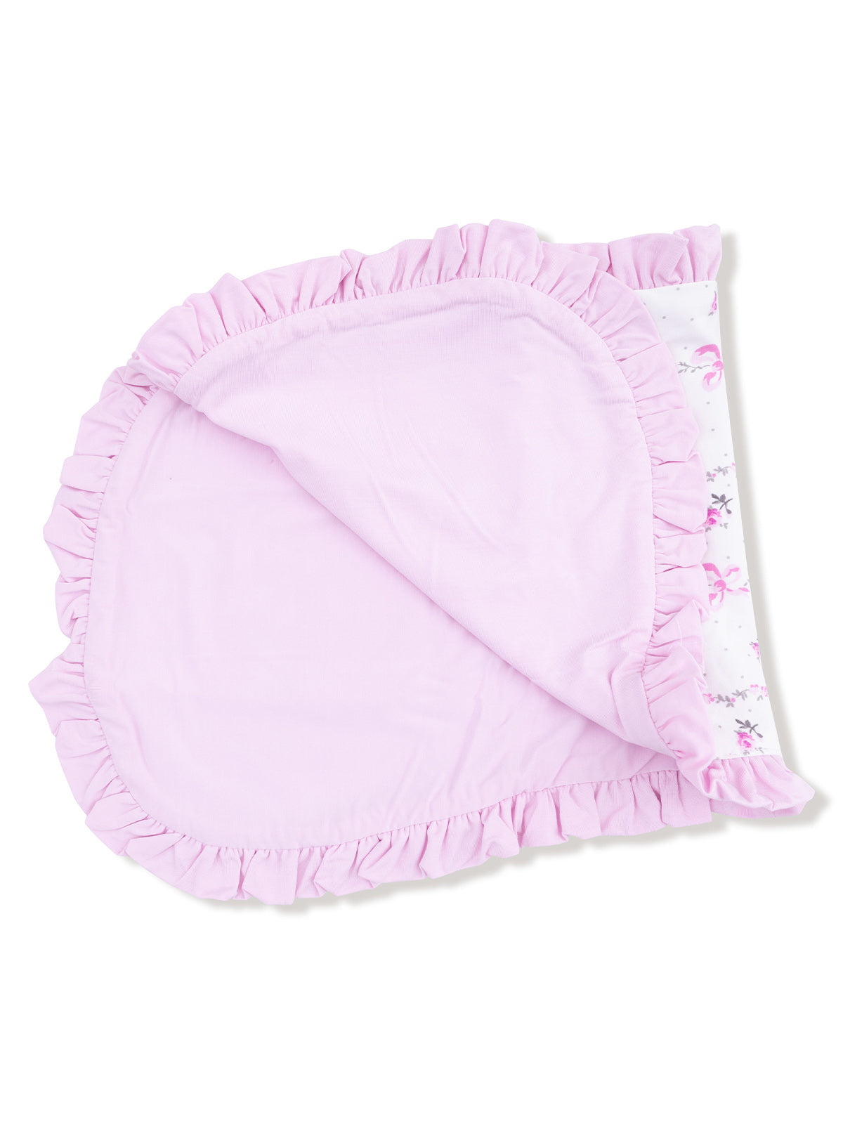 Pink ruffled blanket with floral pattern, folded at an angle on a white background.