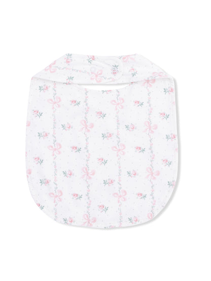 White baby bib with delicate floral patterns and pink bows, featuring a snap closure at the top.