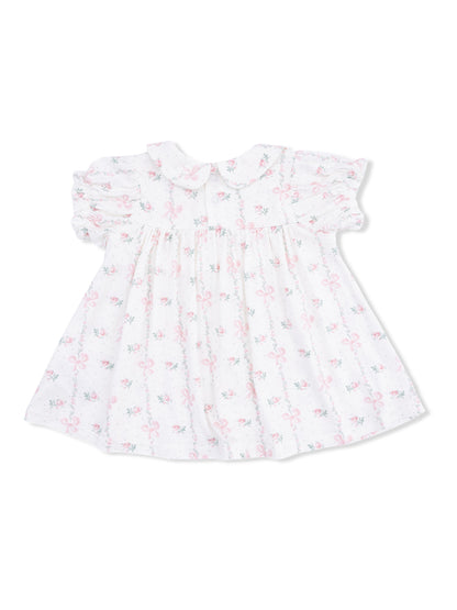 White toddler dress with pink floral patterns and a collar, featuring puff sleeves and a flared skirt.