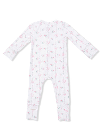 Back view of a floral baby onesie with pink bows on a white background.