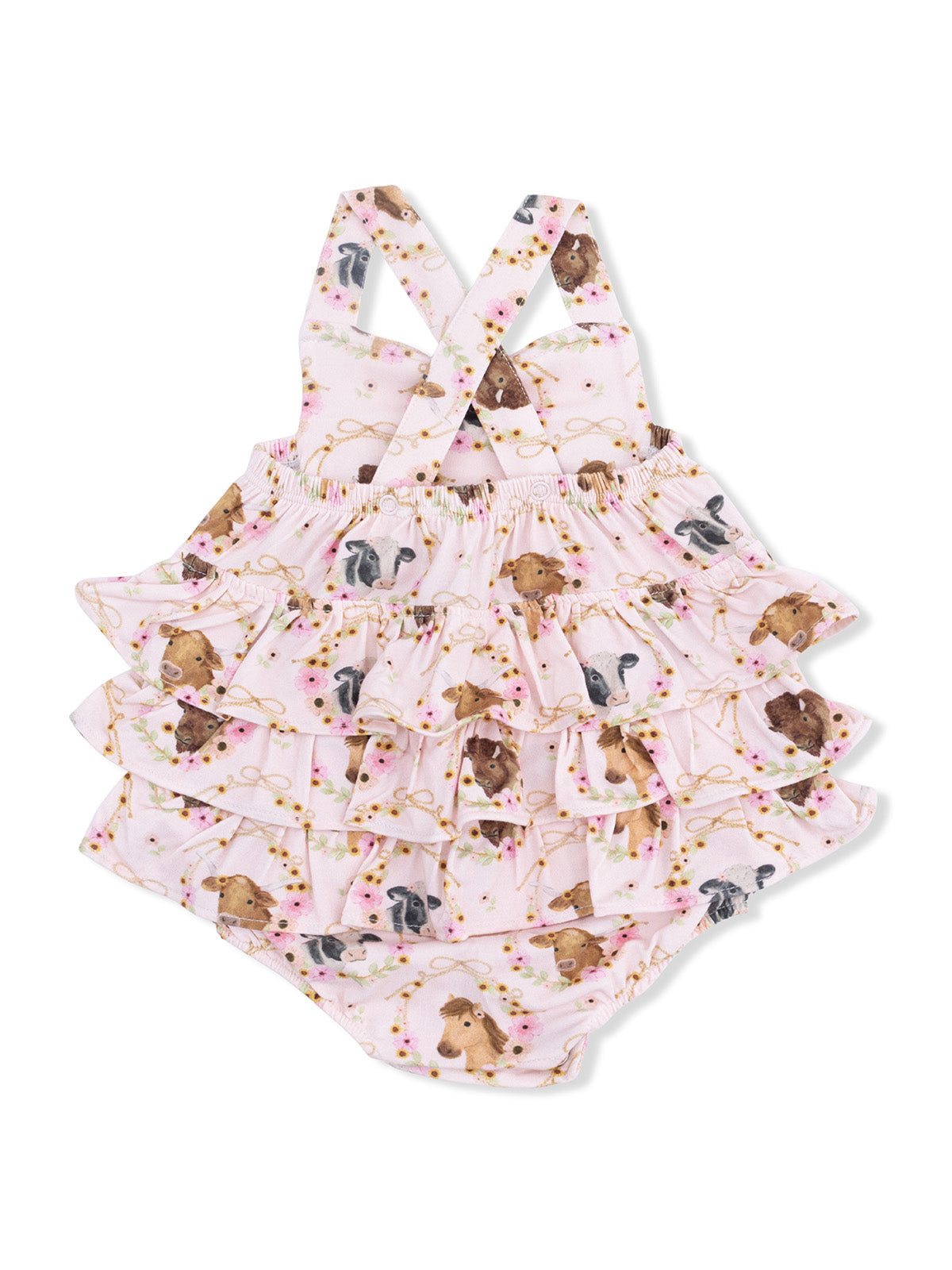 Floral-patterned toddler swimsuit with ruffles and animal illustrations on a pink background.