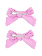 Two pink hair bows with metal clips, styled for a cute and trendy hair accessory.