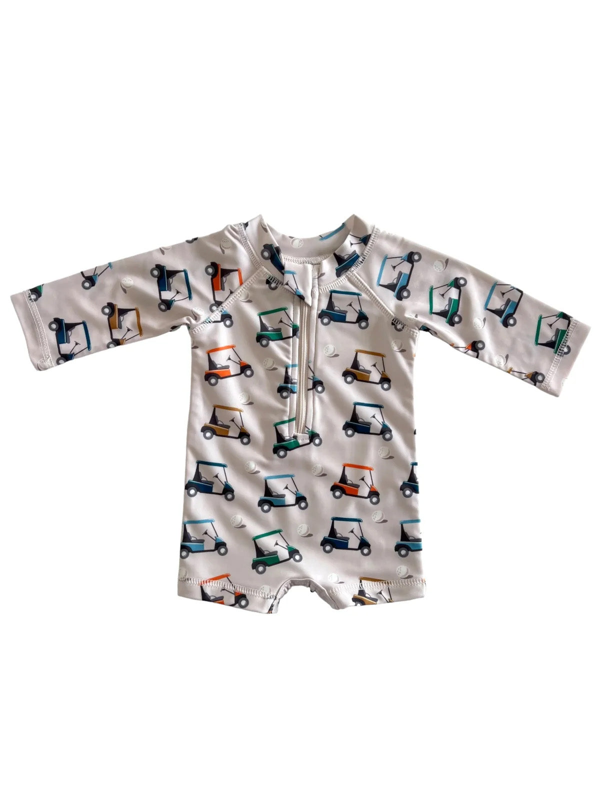Children's rash guard with golf cart print, featuring long sleeves and a front zipper. Ideal for sun protection.