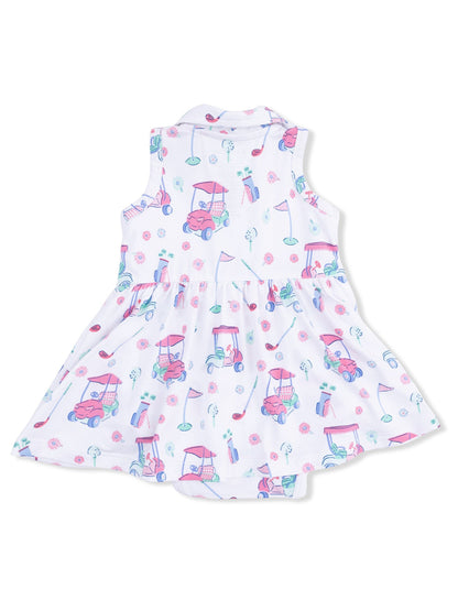 White dress with a playful golf-themed print, featuring golf carts, clubs, and colorful flowers.