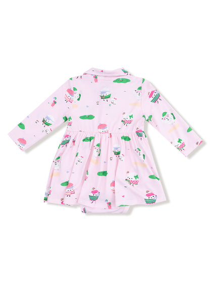 Pink dress with long sleeves, featuring playful cupcake and ice cream prints on a light background.