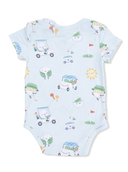 Light blue onesie featuring playful, cartoonish characters in cars, golf items, and cheerful sun illustrations.
