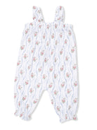 White floral romper with blue and pink flowers, featuring smocked bodice and ruffled straps. Perfect for warm weather.