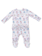 Baby onesie with long sleeves, floral patchwork design, ruffle trim at the waist, and footed bottom.