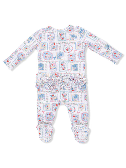 Baby onesie with long sleeves, floral patchwork design, ruffle trim at the waist, and footed bottom.