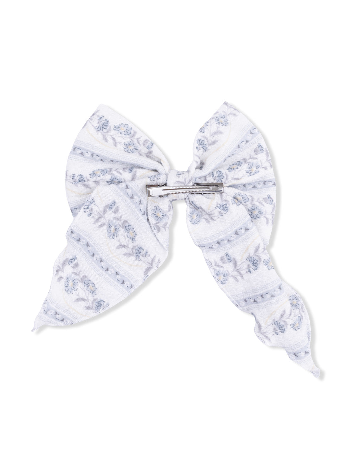 Floral-patterned hair bow in white and blue, featuring a clip for secure hold. Ideal accessory for stylish looks.